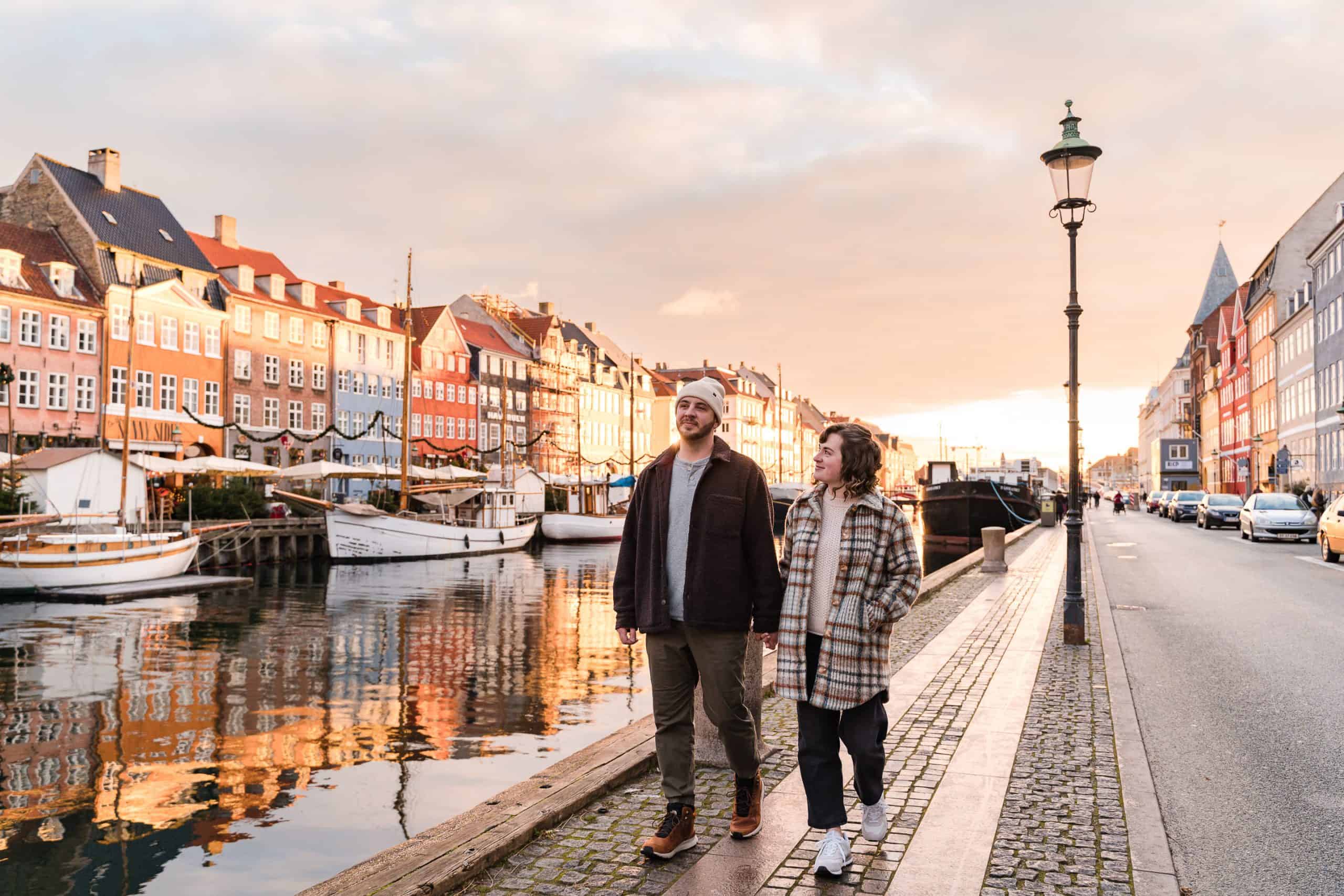 Newly-married-couple-walking-Nyhavn-Copenhagen