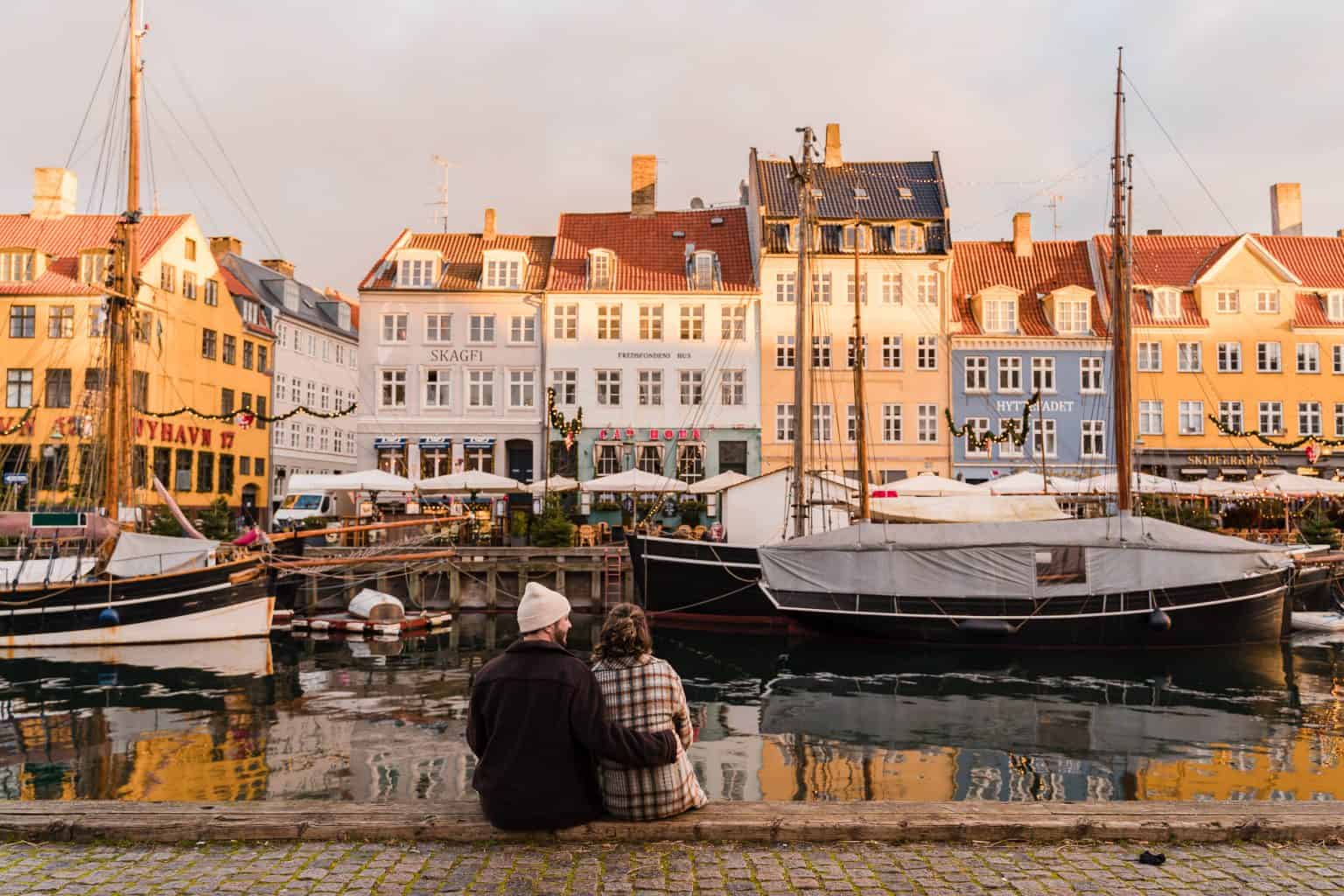Newly-married-couple-sitting-Nyhavn-Copenhagen